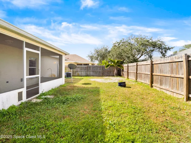 a view of swimming pool with an outdoor seating