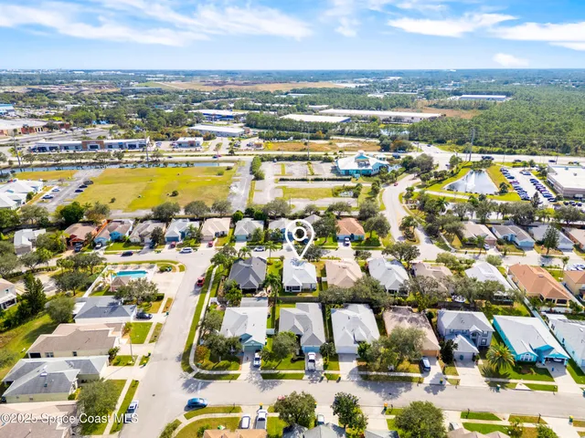 an aerial view of residential houses with outdoor space