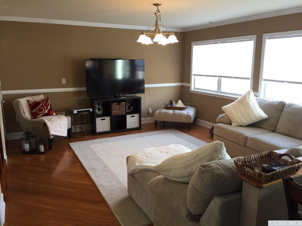 304 Whitney Circle Kinderhook, NY 12184 - Photo 5 of 10 a living room with furniture and a flat screen tv