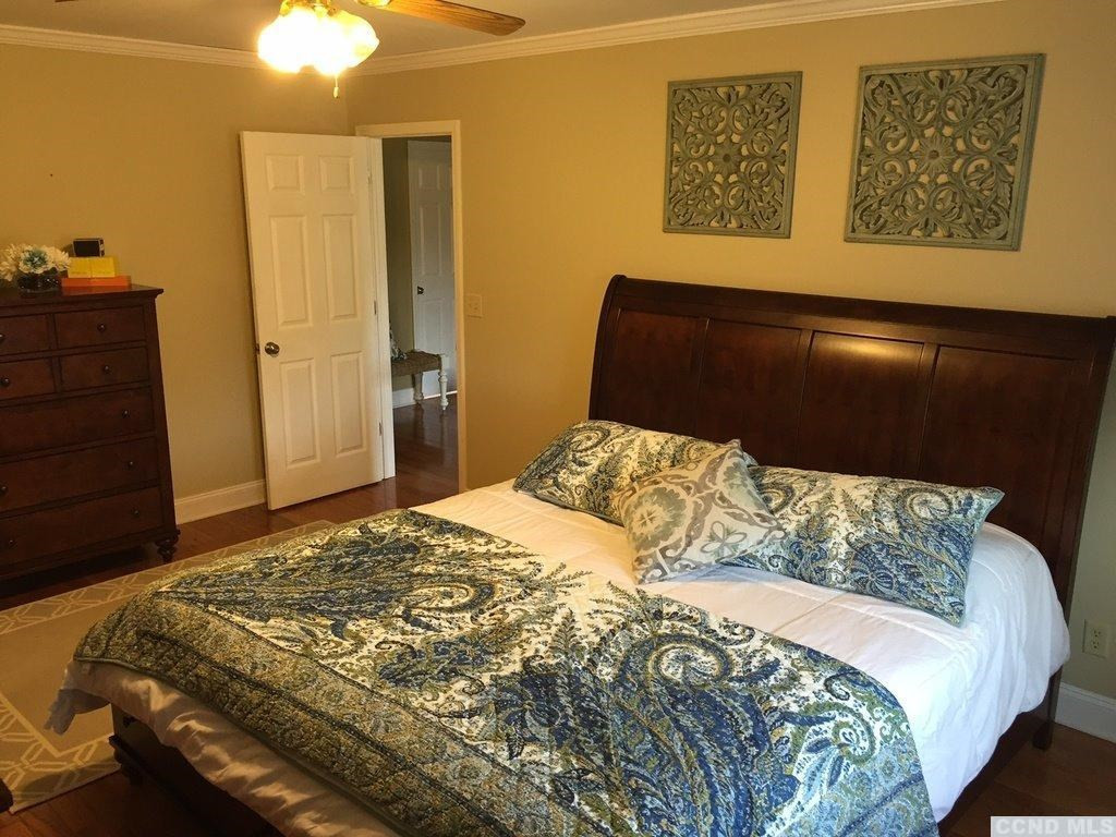 304 Whitney Circle Kinderhook, NY 12184 - Photo 6 of 10 a bedroom with a bed and cupboard