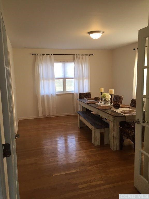 304 Whitney Circle Kinderhook, NY 12184 - Photo 10 of 10 a room with wooden floor and windows