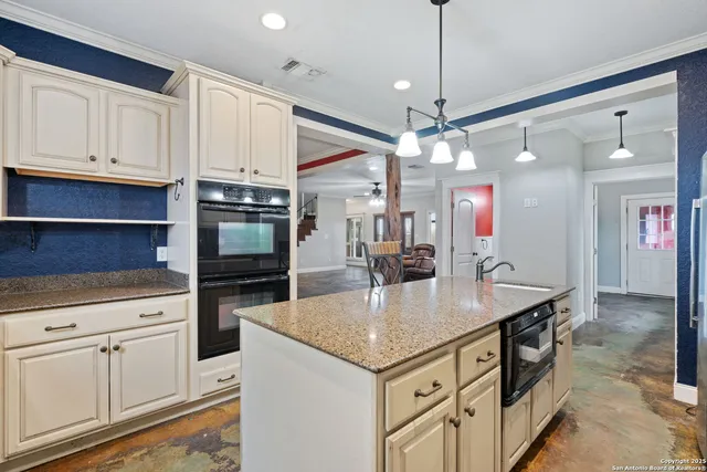 a spacious bathroom with a double vanity sink mirror and shower