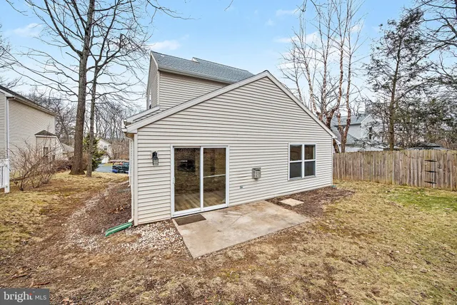 a house that has a tree in front of it