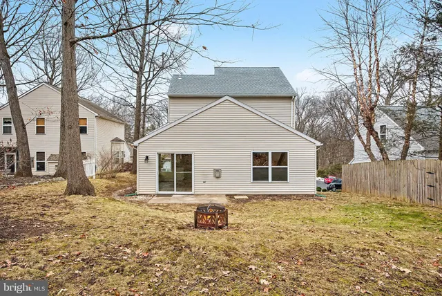 a house that has a tree in front of it