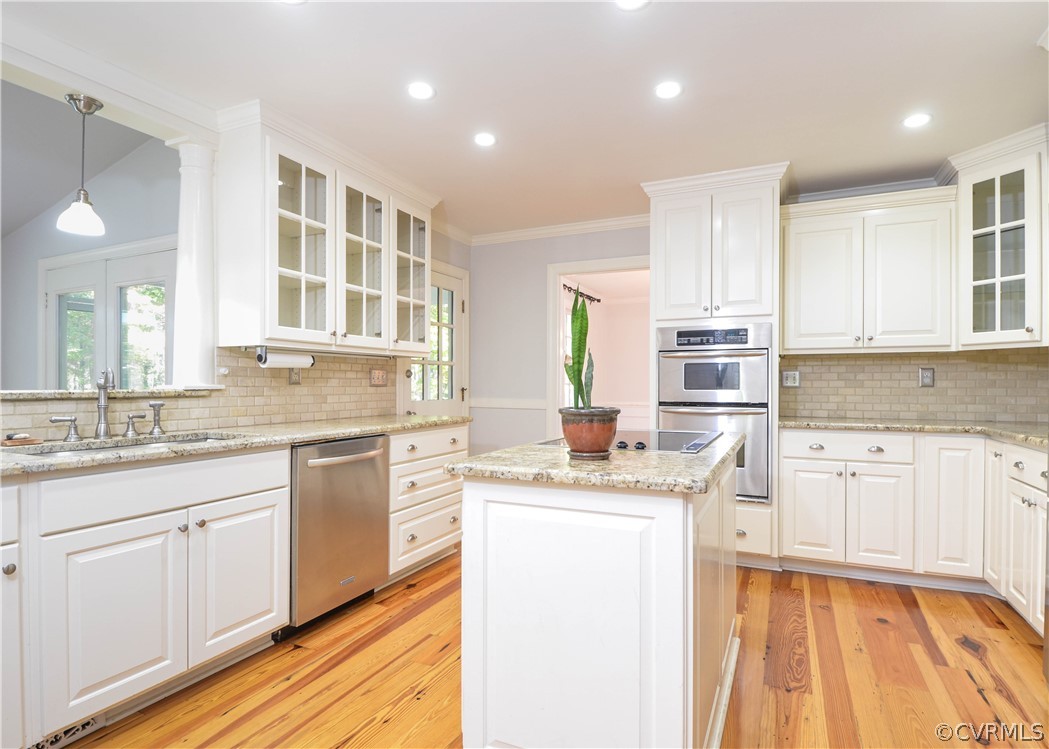 2262 Banstead Road Midlothian, VA 23113 - Photo 10 of 40 Kitchen has pine floors, an island, and all stainl