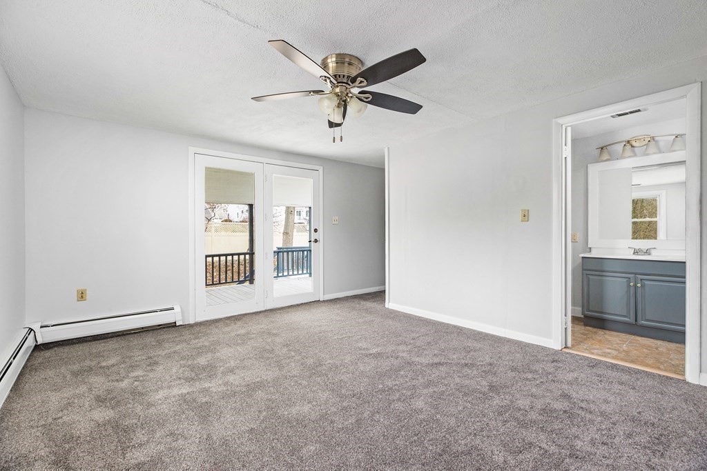 44 Rhodes Circle, Unit 44 Hingham, MA 02043 - Photo 12 of 23 an empty room with closet and windows