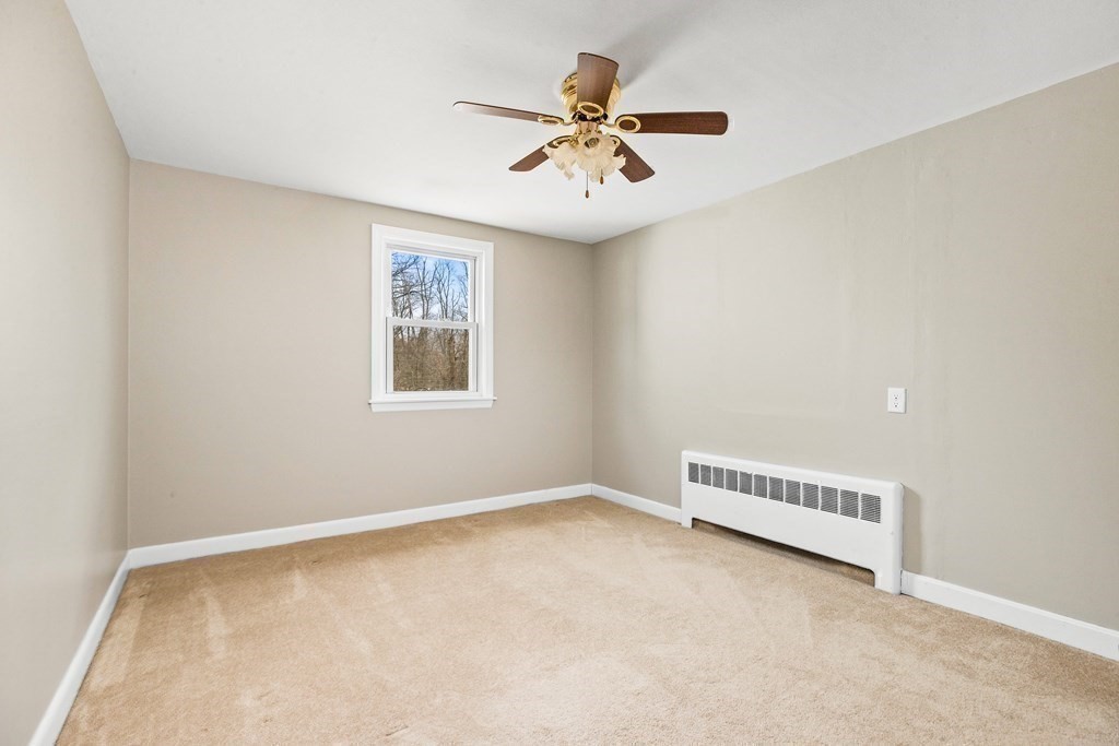 44 Rhodes Circle, Unit 44 Hingham, MA 02043 - Photo 16 of 23 an empty room with a window