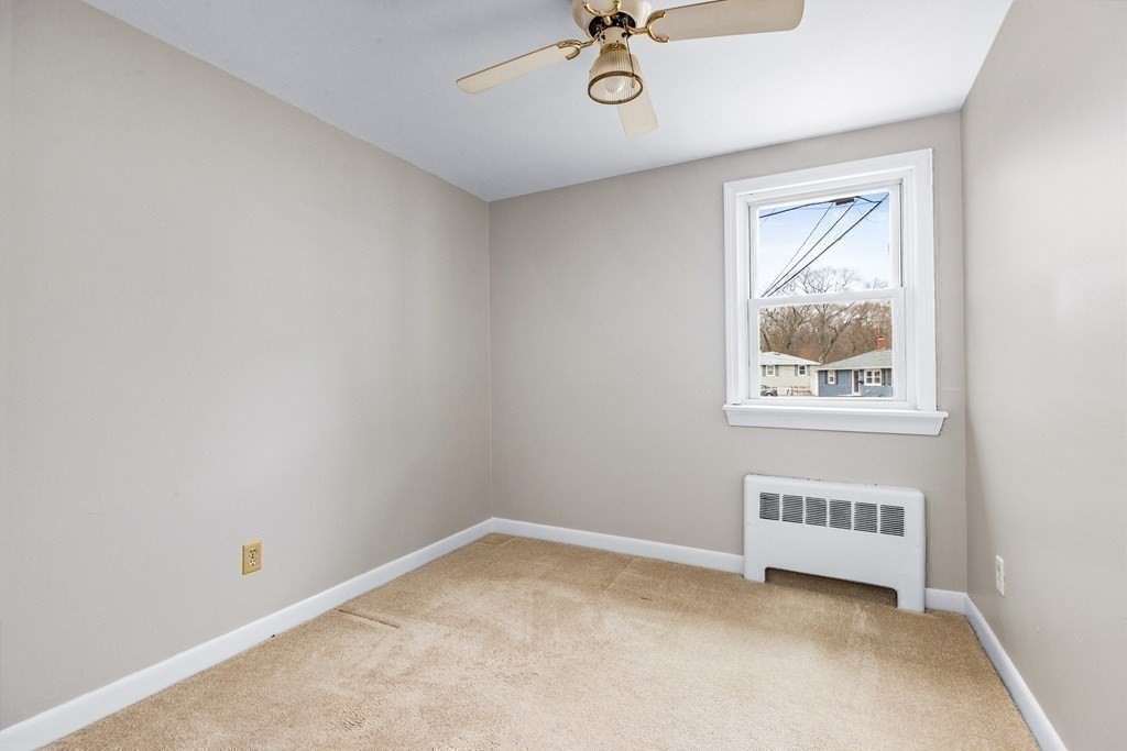 44 Rhodes Circle, Unit 44 Hingham, MA 02043 - Photo 20 of 23 a view of an empty room with a window