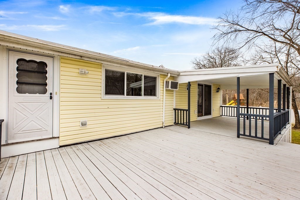 44 Rhodes Circle, Unit 44 Hingham, MA 02043 - Photo 2 of 23 a view of a house with deck