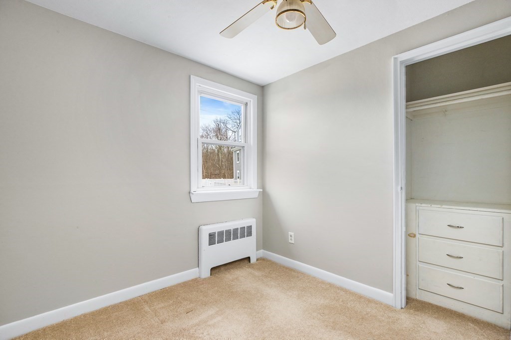 44 Rhodes Circle, Unit 44 Hingham, MA 02043 - Photo 21 of 23 a view of an empty room with a window