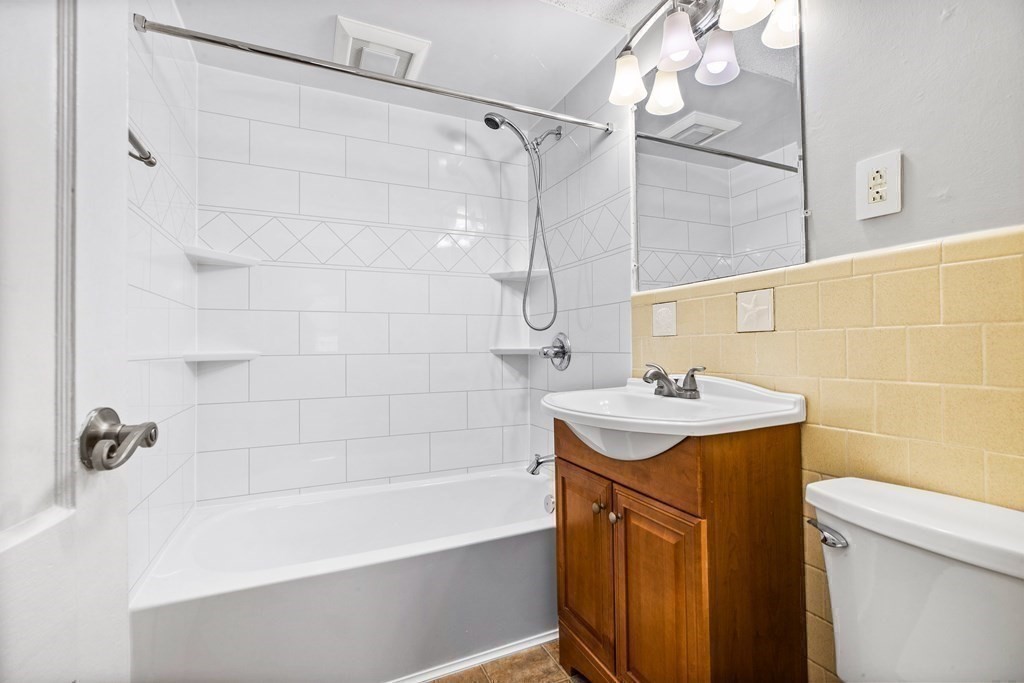 44 Rhodes Circle, Unit 44 Hingham, MA 02043 - Photo 22 of 23 a bathroom with a sink a toilet and shower