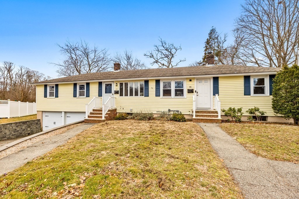 44 Rhodes Circle, Unit 44 Hingham, MA 02043 - Photo 23 of 23 a front view of a house with a yard