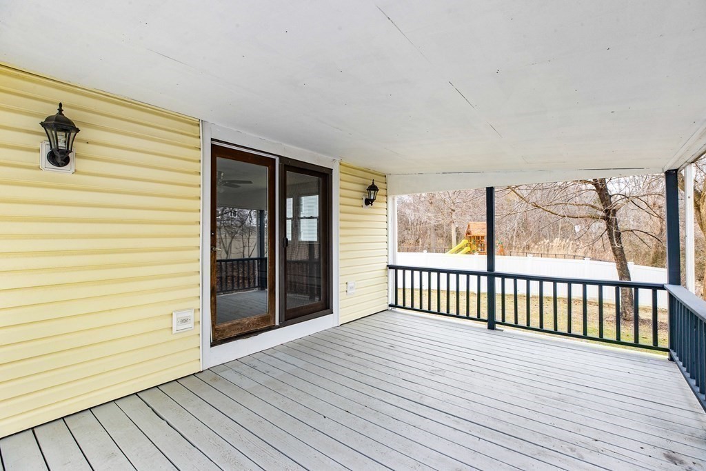 44 Rhodes Circle, Unit 44 Hingham, MA 02043 - Photo 3 of 23 a view of a balcony with wooden floor
