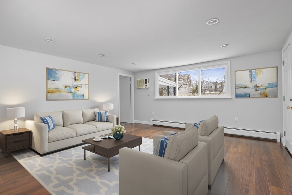 44 Rhodes Circle, Unit 44 Hingham, MA 02043 - Photo 10 of 23 a living room with furniture and a wooden floor
