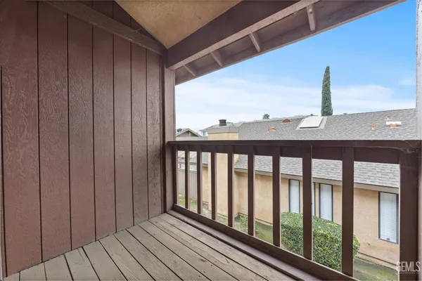 a view of balcony with wooden floor