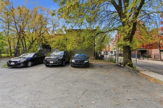 a view of a cars parked in front of a house