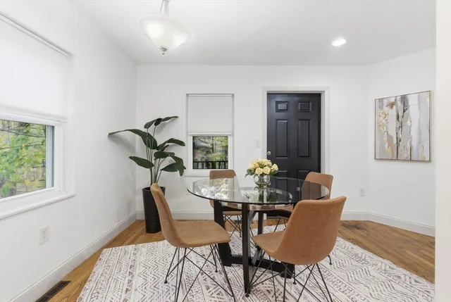 a view of a dining room with furniture and window