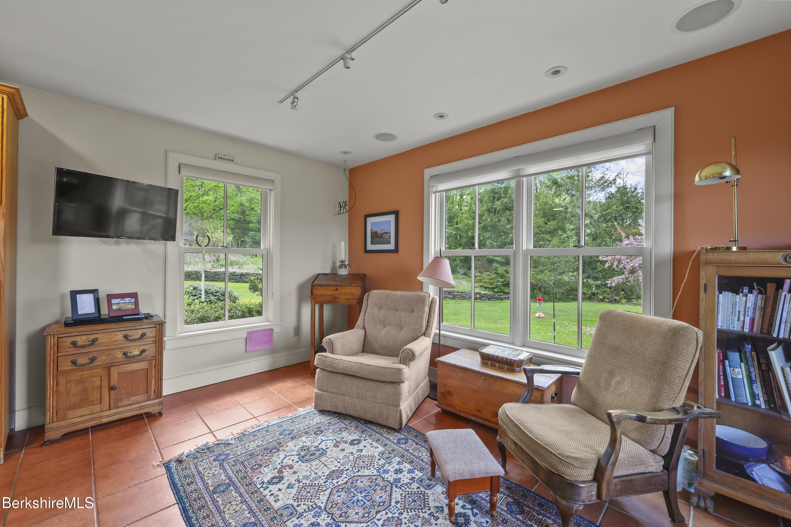 821 Pattison Road North Adams, MA 01247 - Photo 30 of 68 a living room with furniture a large window and a flat screen tv