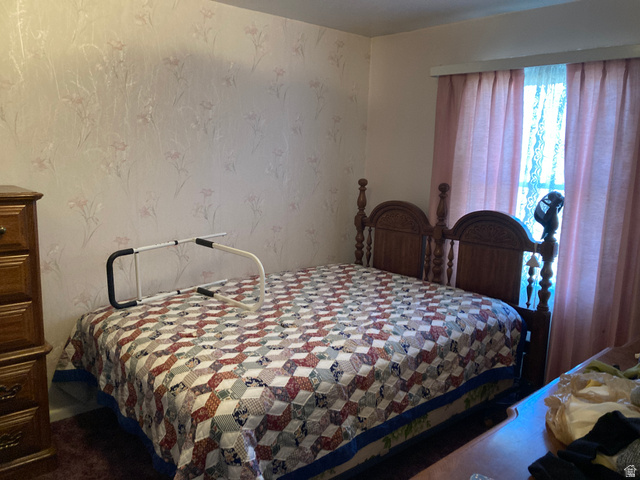 200 South 2800th Street West Ogden, UT 84404 - Photo 10 of 42 Bedroom featuring wallpapered walls