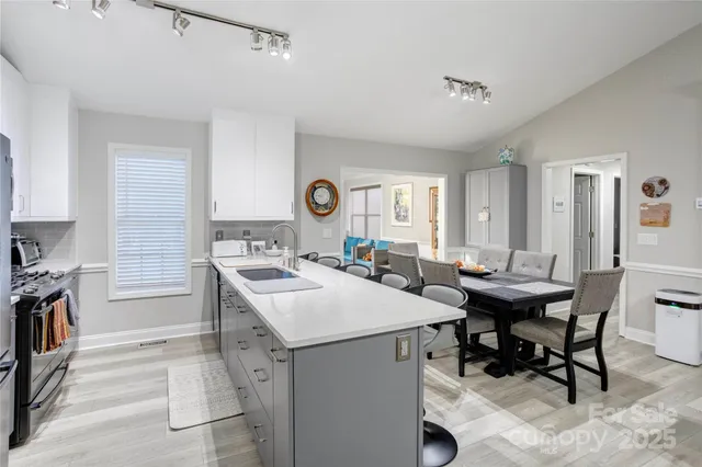 a view of a kitchen area with furniture and a window