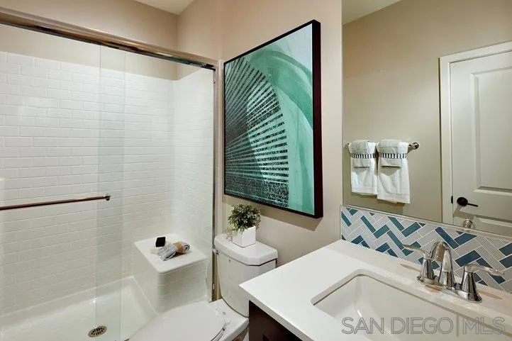 3543 Conner Way Oceanside, CA 92056 - Photo 11 of 17 a bathroom with a sink and a mirror