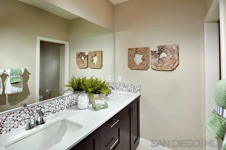3543 Conner Way Oceanside, CA 92056 - Photo 14 of 17 a bathroom with a sink and a mirror