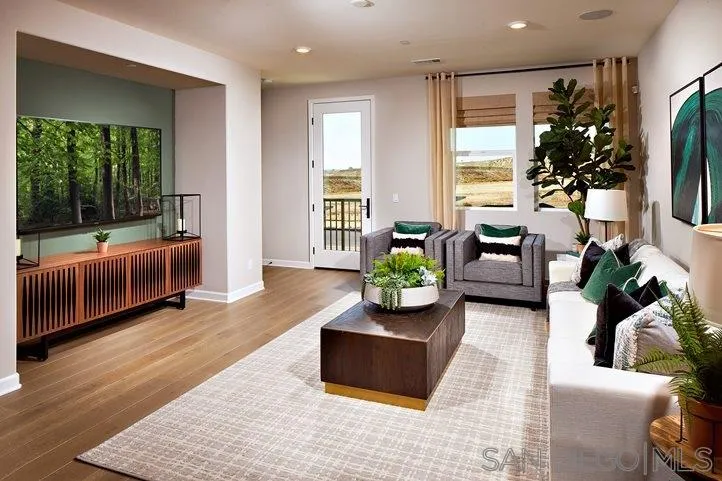 3543 Conner Way Oceanside, CA 92056 - Photo 5 of 17 a living room with furniture fireplace and flat screen tv