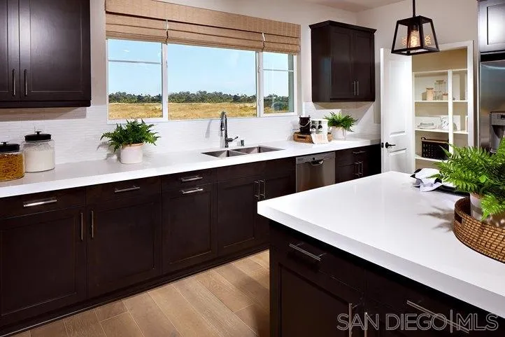 3543 Conner Way Oceanside, CA 92056 - Photo 7 of 17 a kitchen with a sink and large window