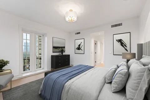 a room with kitchen island a sink and a large window