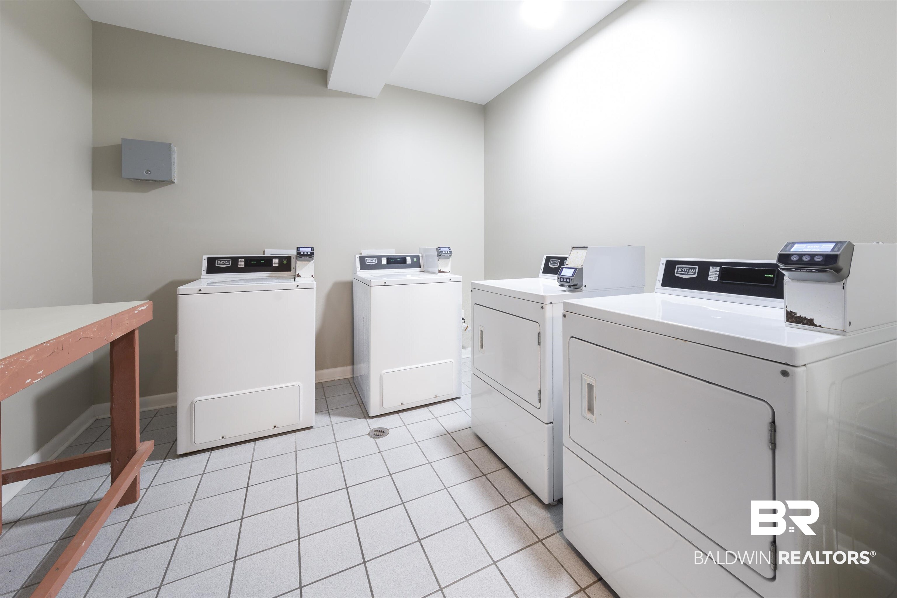 400 Plantation Road, Unit 2123 Gulf Shores, AL 36542 - Photo 27 of 44 Laundry room featuring washer and dryer and light tile patterned floors