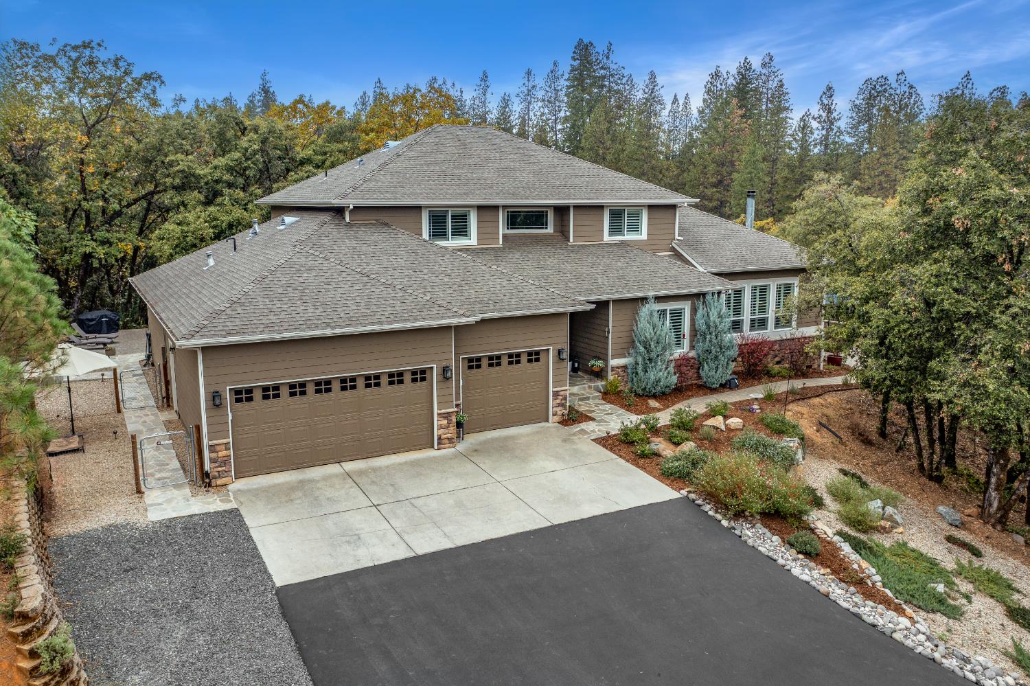 910 Eden Valley Road Colfax, CA 95713 - Photo 1 of 1 a front view of a house with a yard and garage