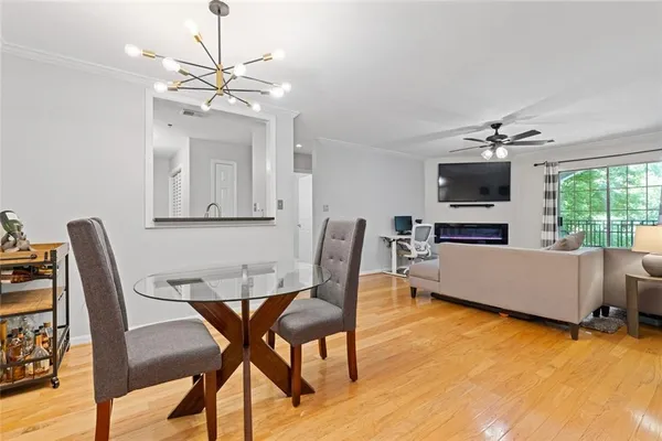 a view of a dining room with furniture window and wooden floor