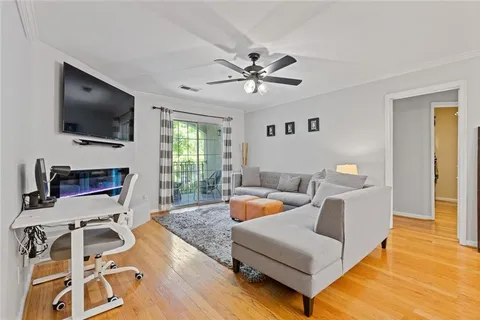 a living room with furniture and a flat screen tv