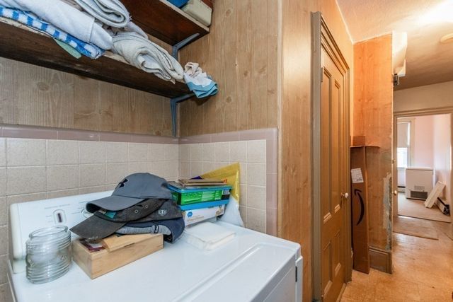 a room with furniture and gym equipment