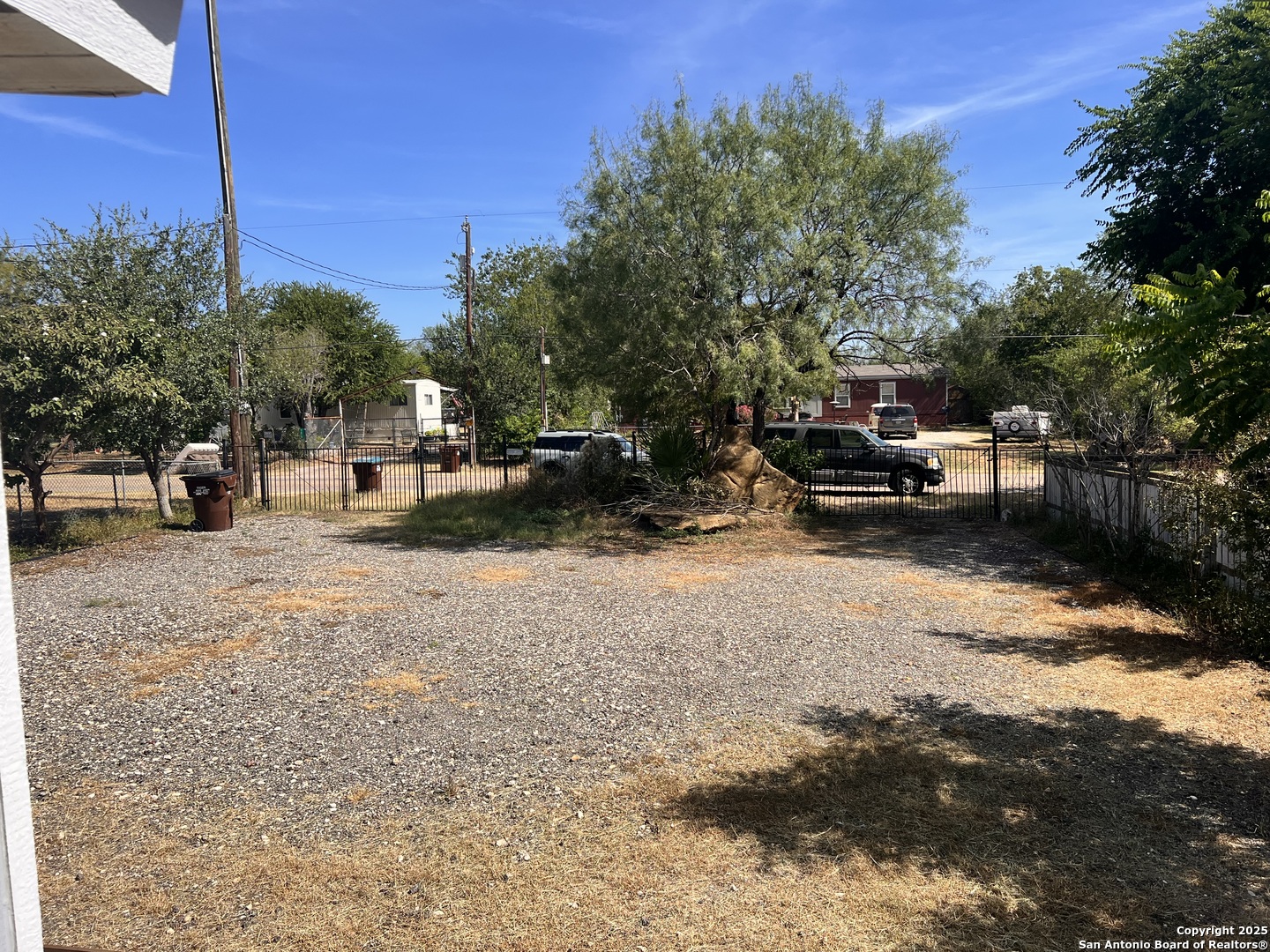 7614 Von Ormy Road Von Ormy, TX 78073 - Photo 1 of 27 a view of street with parked cars