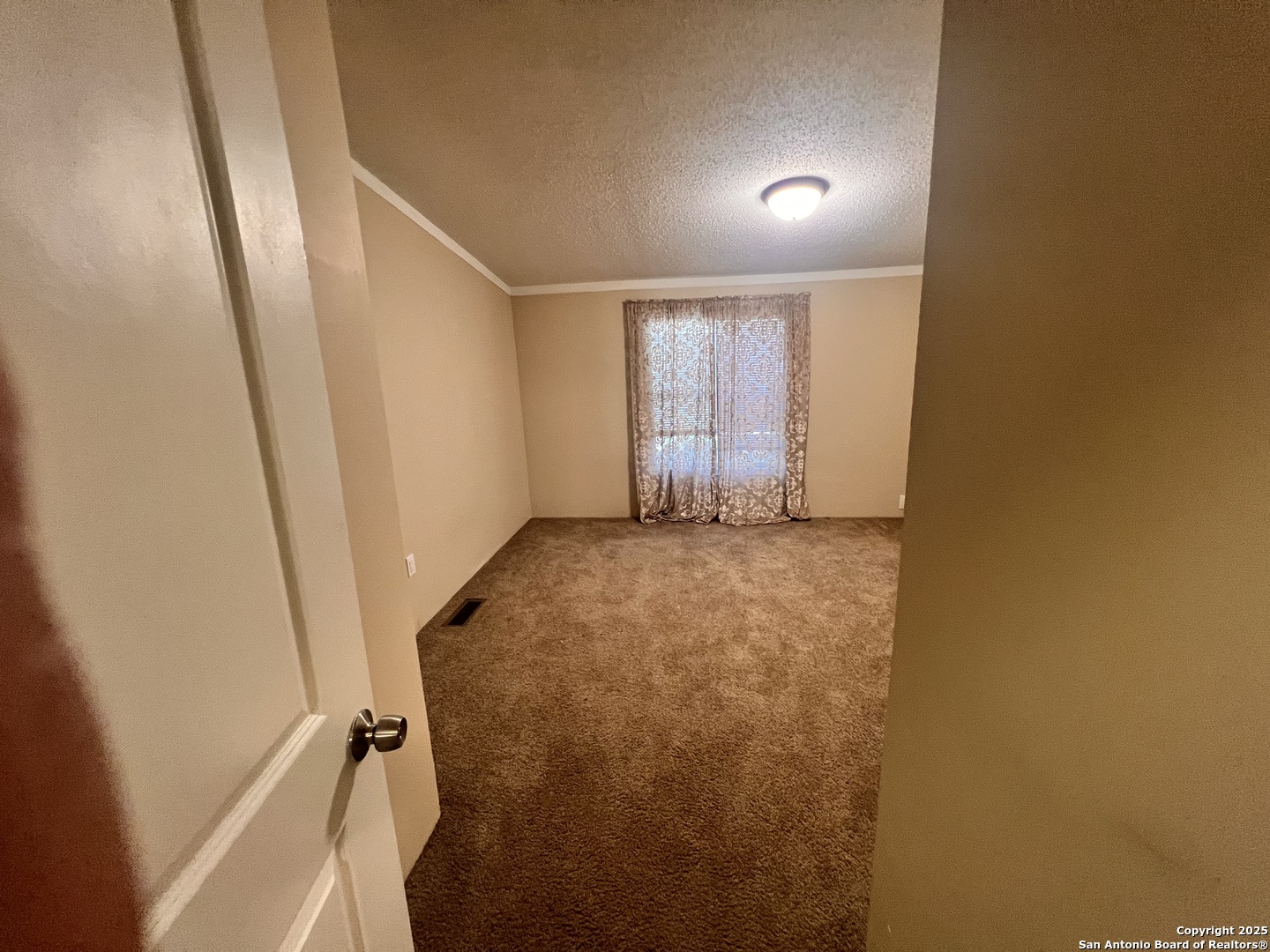 7614 Von Ormy Road Von Ormy, TX 78073 - Photo 11 of 27 a view of an empty room