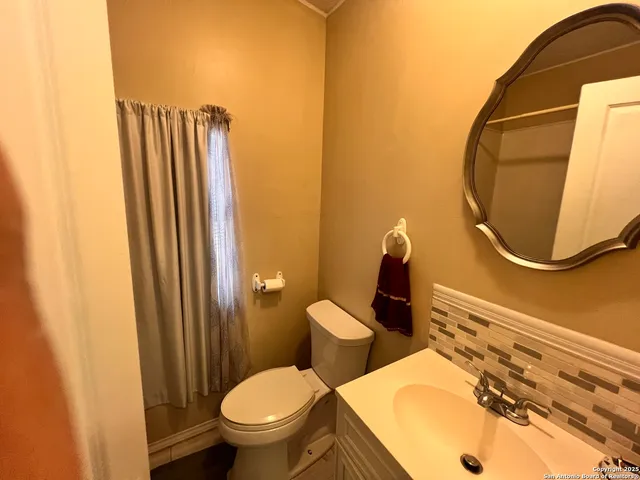 a bathroom with a tub and shower