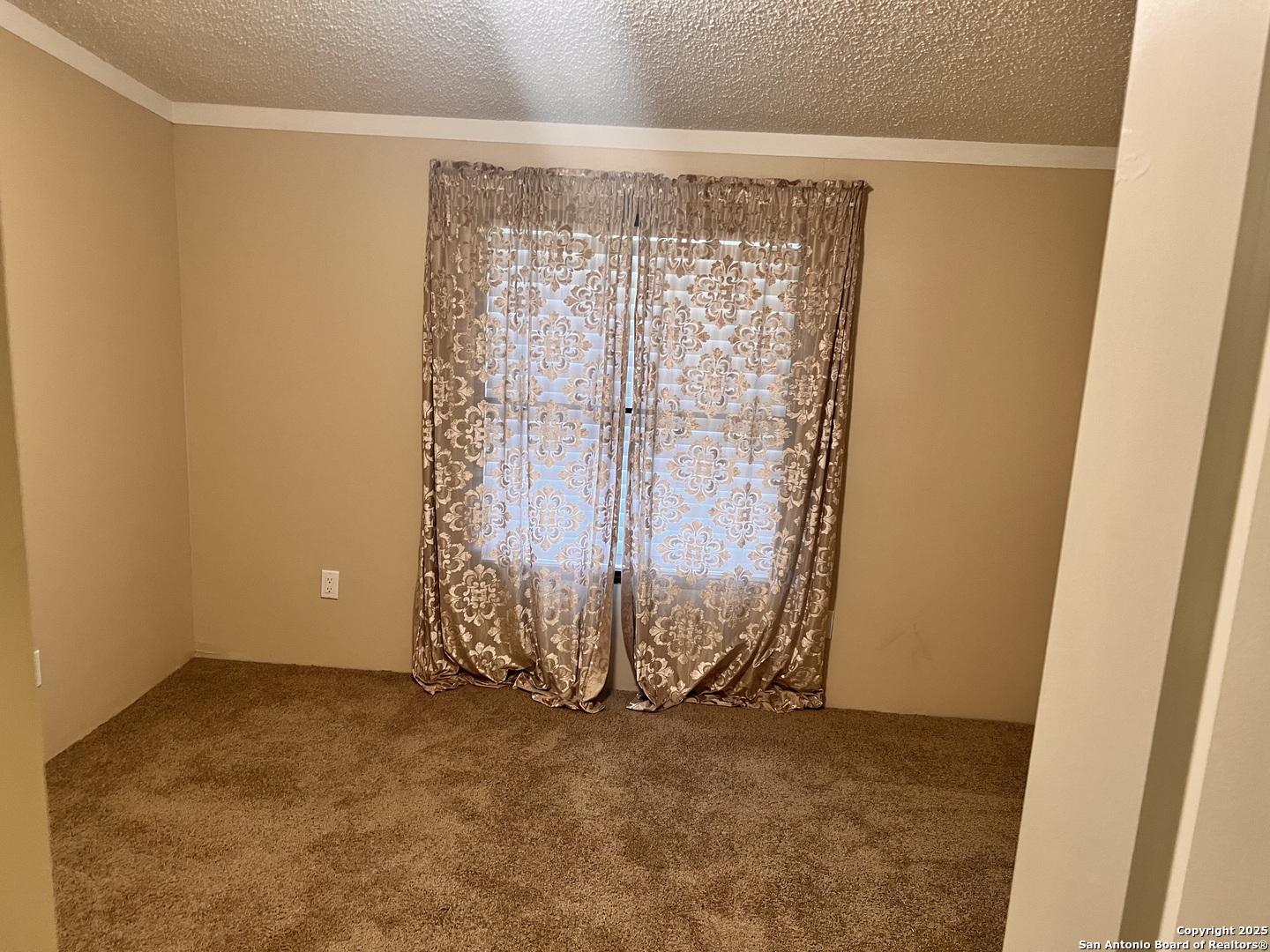 7614 Von Ormy Road Von Ormy, TX 78073 - Photo 16 of 27 an empty room with a door