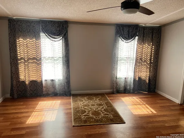 a view of fireplace and wooden floor