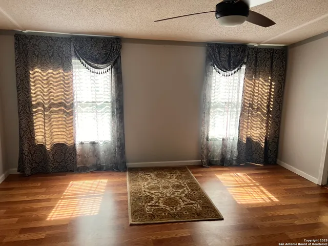 a view of fireplace and wooden floor