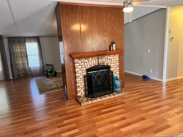 a kitchen with wooden cabinets and stainless steel appliances