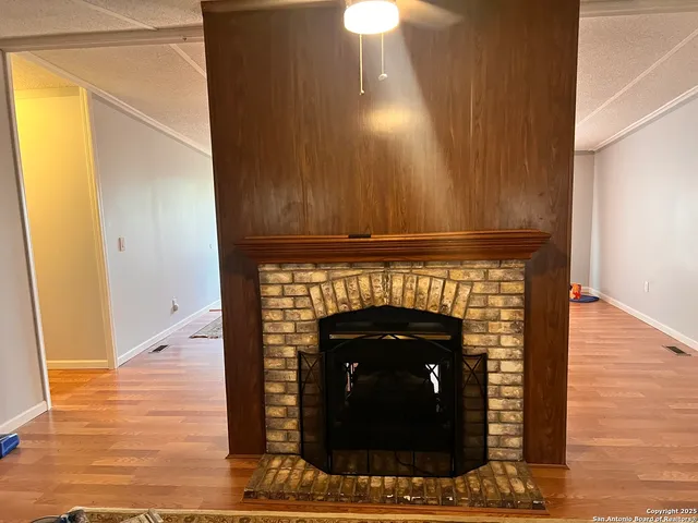 a bedroom with a bed and a fireplace