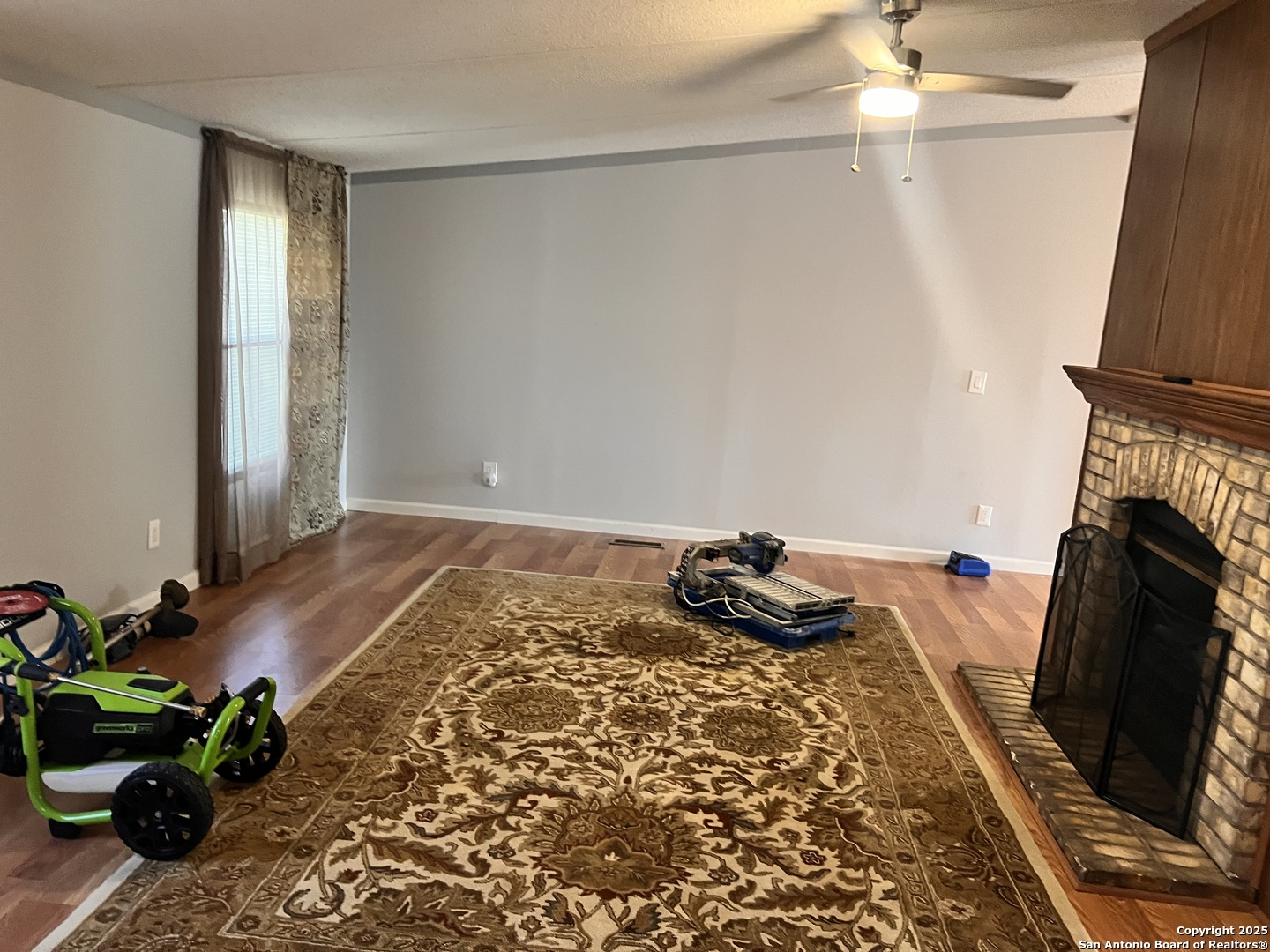 7614 Von Ormy Road Von Ormy, TX 78073 - Photo 25 of 27 a bedroom with a bed and a fireplace