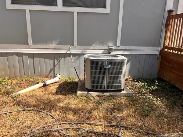 a view of a house with a tree in the background