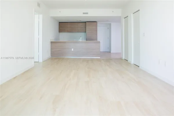 a view of hallway with a large window