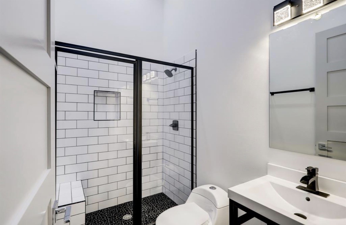 1709 Reverse Street Houston, TX 77055 - Photo 14 of 29 a bathroom with a sink and a mirror