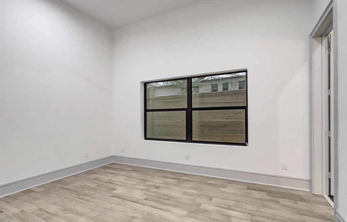 1709 Reverse Street Houston, TX 77055 - Photo 15 of 29 an empty room with a window