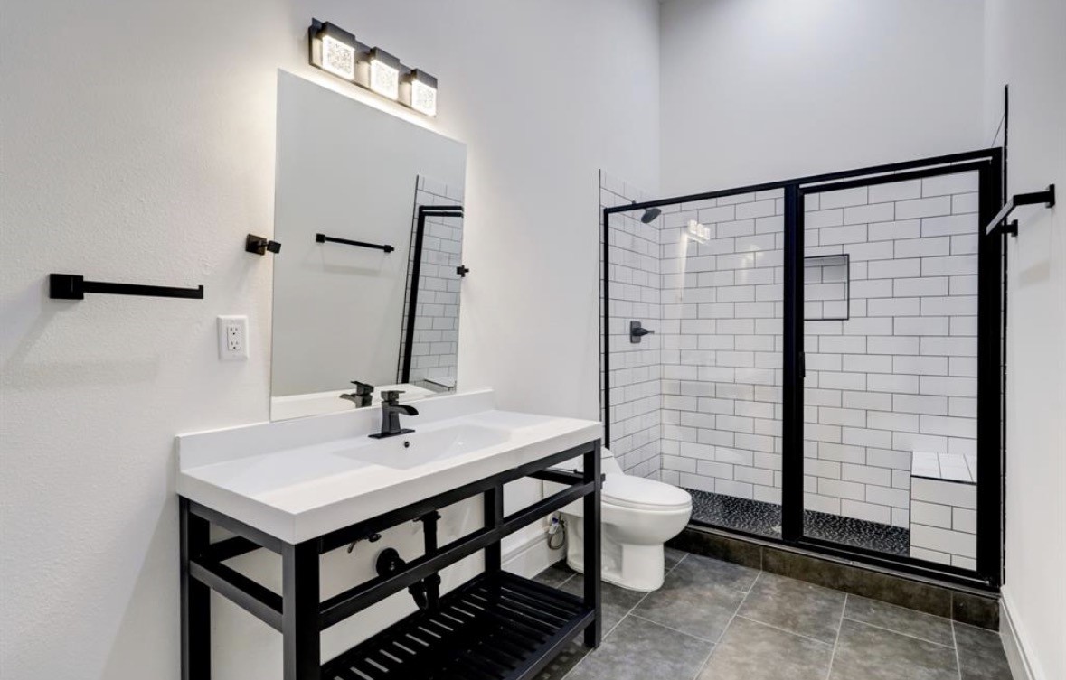 1709 Reverse Street Houston, TX 77055 - Photo 16 of 29 a bathroom with a sink a toilet and shower