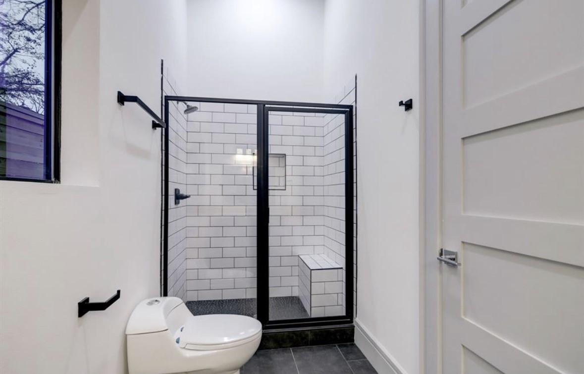 1709 Reverse Street Houston, TX 77055 - Photo 18 of 29 a bathroom with a toilet and shower