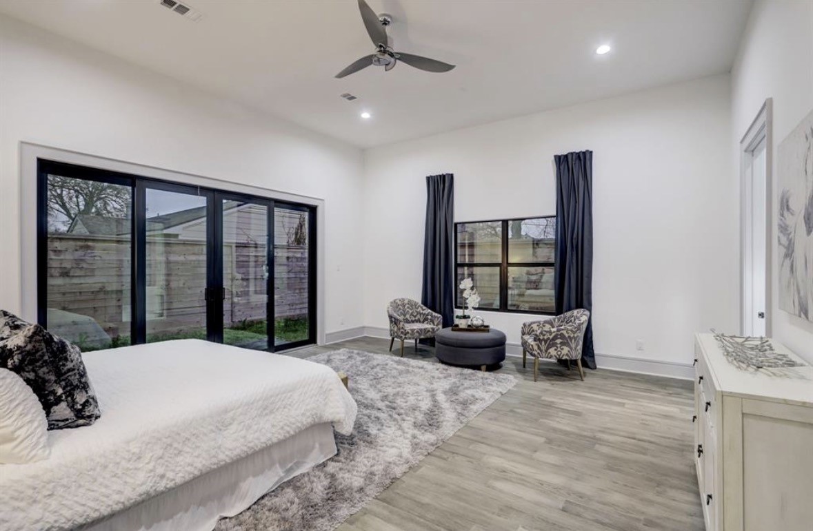1709 Reverse Street Houston, TX 77055 - Photo 19 of 29 a bedroom with a large bed and large windows